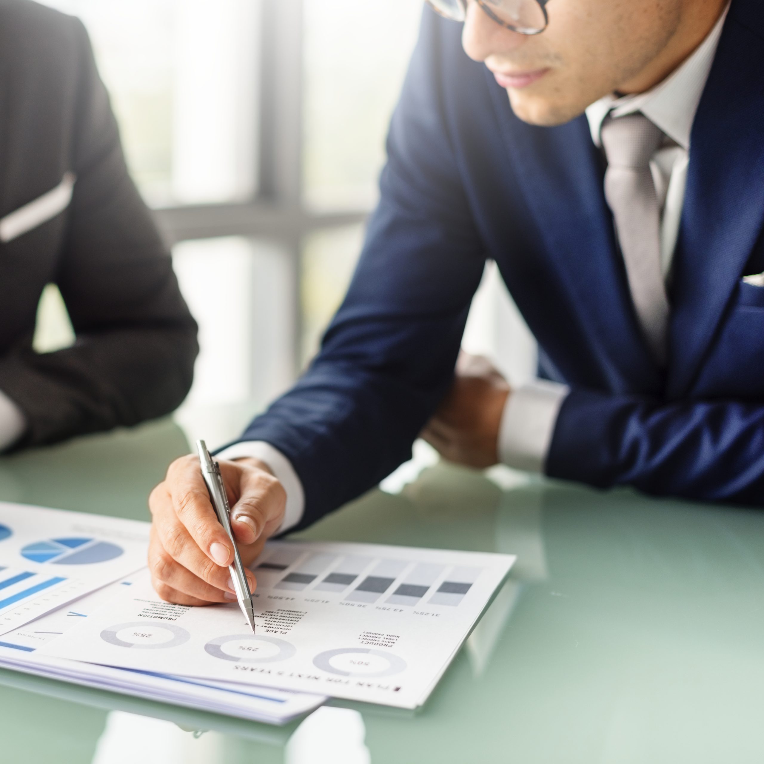 Businessman reviewing reports, representing Grand Cayman services.