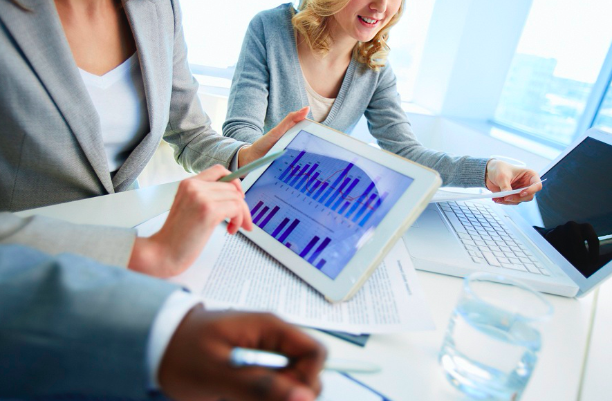 business professionals working on outsourcing decisions