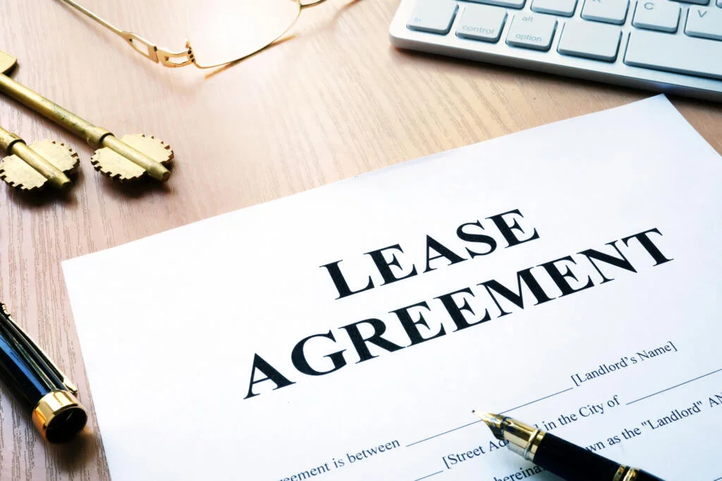 close-up of a paper with a written lease agreement on it