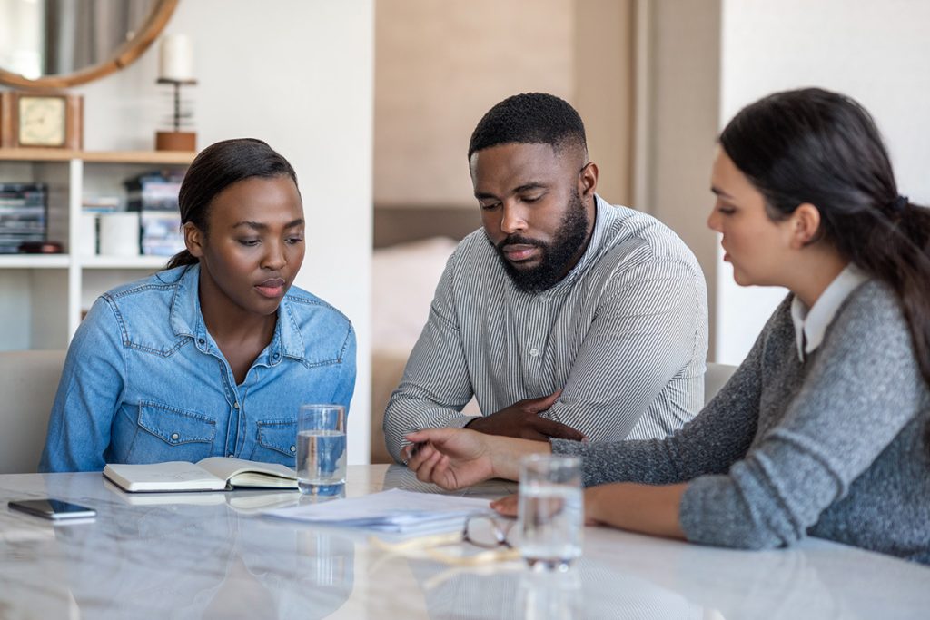 3 business experts discussing financial strategies