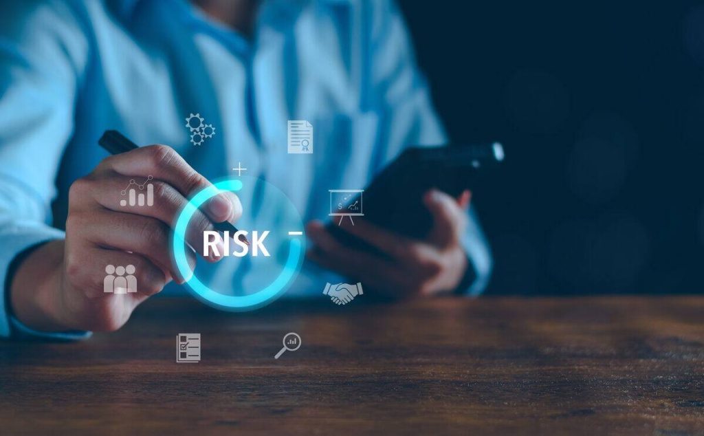 Person interacting with a digital risk management interface on a smartphone
