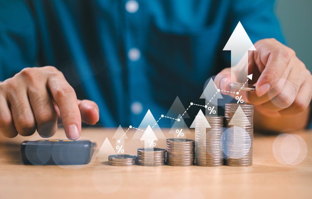 Person stacking coins with growth chart and percentage icons, symbolizing financial growth, investment returns, or risk management